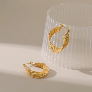 Elegant 18K gold plated braided hoop earrings with a textured geometric twist design