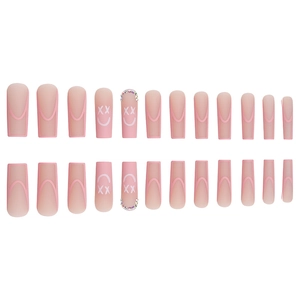 Pink matte long ballerina press-on nails with smile face designs and rhinestones
