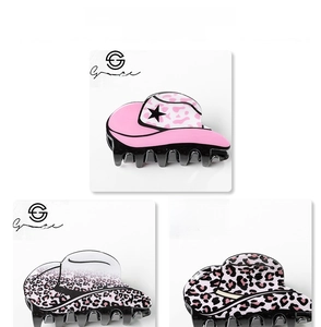 Close-up of pink leopard and star pattern cowboy hat hair claws on display cards