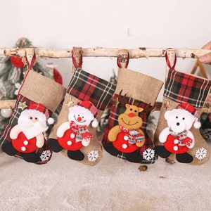 Detail of four burlap Christmas stockings with 3D Santa Snowman Reindeer and Bear