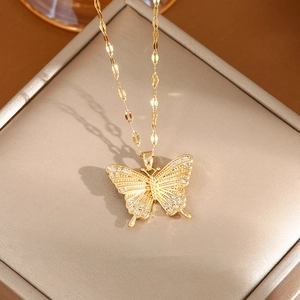 Elegant gold butterfly necklace with sparkling zircon wings on premium jewelry box