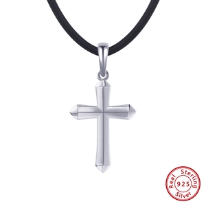 Detailed view of sterling silver 925 cross pendant with minimalist black cord necklace