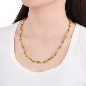Hip-hop style gold interlocking chain necklace with curved bars and spherical beads