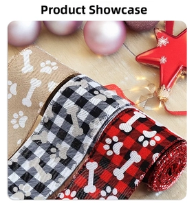 Detail of Christmas ribbons with plaid patterns and paw prints for pet gift wrapping
