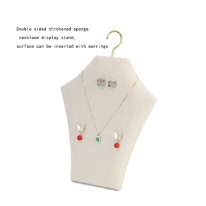 Beige sponge necklace display stand with gold metal hooks and earring insertion surface
