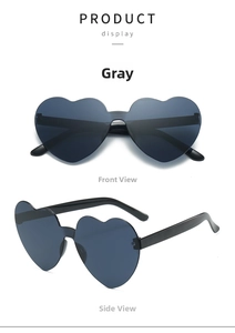 Close-up of rimless heart-shaped grey sunglasses with polished black plastic temples