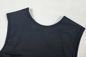 Close-up of crew neckline and stitching on black mesh bodysuit with dual needle edges