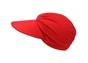 Detail view of red wide-brim sun hat with soft fabric texture and pleated wrap design