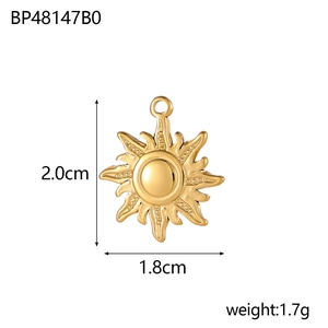 Detailed view of gold sun pendant with measurements 2.0cm height and 1.8cm width