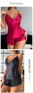 Detail of satin sleepwear set with lace V-neck trim in burgundy and black colors