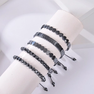 Adjustable magnetic hematite bead bracelets set with heart and arrow shapes in black finish