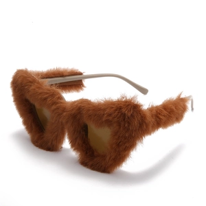 Brown heart-shaped sunglasses with faux fur frame shown in a 45-degree angle view