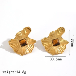 Detailed view of irregular gold fan-shaped earrings with brown gemstone and size specs