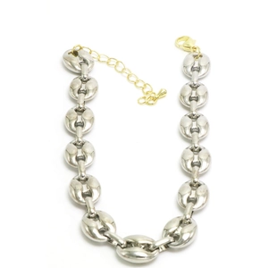 Detail of silver oval bean link chain with golden extender and lobster clasp closure