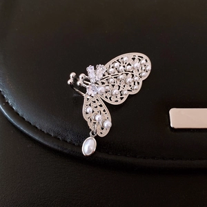Vintage silver butterfly earrings with sparkling crystals and elegant pearl pendants