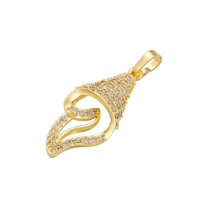 Detailed macro of a gold seashell pendant encrusted with sparkling zircon gemstones