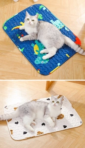 Detail view of cartoon dinosaur and bear pattern pet sleeping mats with wavy quilting