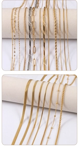 Macro shot of 18K gold plated stainless steel chain styles on a display stand