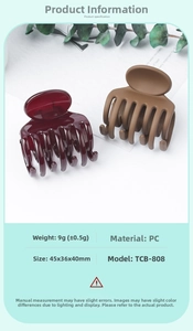Detailed view of PC material hair clips in matte brown and glossy wine red finishes