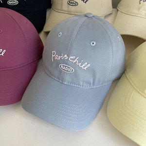 Macro shot of Paris chill embroidery and premium cotton twill texture on a baseball cap