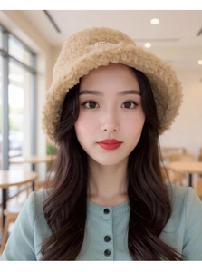 Close-up of khaki lamb wool bucket hat with soft plush texture for winter style