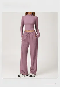 Detailed close-up of purple high-waisted wide-leg yoga pants with adjustable drawstring