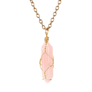 Close-up of pink crystal hexagonal pillar pendant with handmade gold wire wrapping detail
