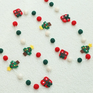 Handmade wool felt Christmas garland with colorful balls, pine trees, and gift box charms