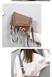 Detail of khaki leather shoulder bag with colorful braided edges and woven wide strap