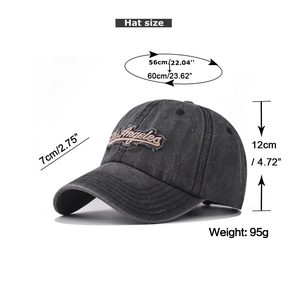 Detail of Los Angeles embroidery on washed grey cotton baseball cap showing 95g weight