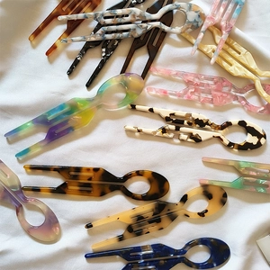 U-shaped acetate hair forks in various marble patterns for stylish women's updos