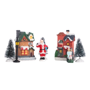 Détail de l'ensemble de village de Noël en résine avec figurines et maisons LED