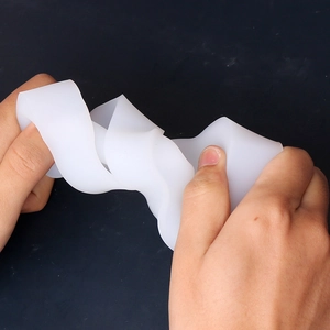 Close-up of flexible white silicone mold showing high elasticity and durable texture