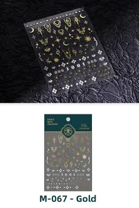 Macro view of gold and silver metallic nail art stickers with moon and star patterns