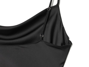 Detail showing adjustable straps and smooth black satin texture of the summer dress