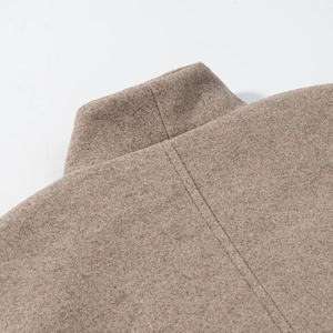 Detailed close-up of the back collar and wool texture on a camel double-breasted coat