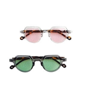 Vintage small round sunglasses in pink and green lenses with stylish tortoiseshell frames