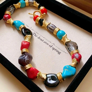 Detailed close-up of a vintage French style beaded necklace with OT toggle clasp detail