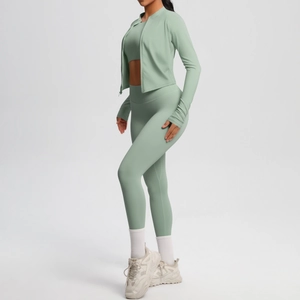 Detail of high waist yoga leggings and zip jacket with seamless elastic fabric texture