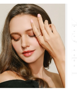 Detail of 925 sterling silver rings with moissanite, worn by model, showing elegant design
