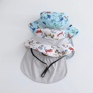 Detailed view of kids sun hats with dinosaur and truck prints and long neck protection flap