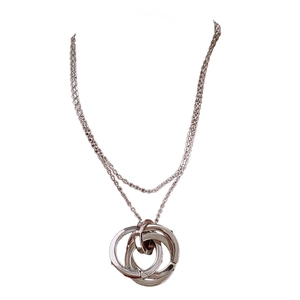 Minimalist silver triple interlocking circle pendant necklace with a fine cable chain