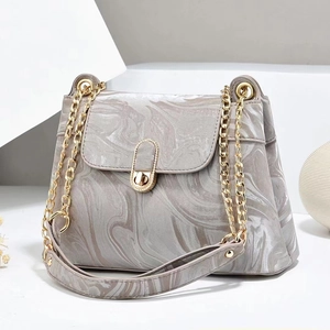 Gray marble print crossbody bag for women with gold chain strap and turn-lock closure