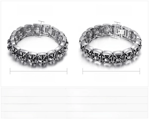Detail view of retro skull and cross relief on heavy stainless steel punk bracelet
