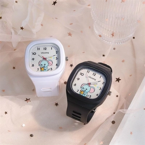 Close-up of cute elephant cartoon watches with silicone straps on cream lace background
