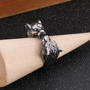 Macro detail of antique silver double wolf head ring with vintage gothic engraving