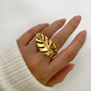 Minimalist 18k gold plated stainless steel leaf ring shown on a hand model