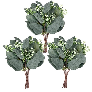 Three bundles of artificial green eucalyptus leaves with small white flowers for home decor