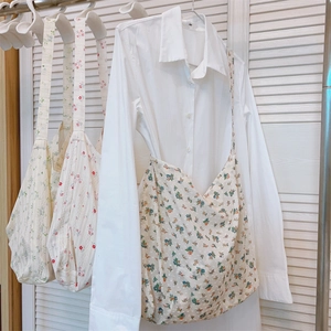 Three floral cotton tote bags with shoulder straps in varied vintage patterns