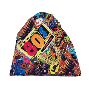 Close-up of 80s retro graffiti knit beanie with all-over pop art print and slogan patterns